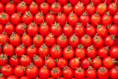 Kırmızı vişneli domateslerin arka plan görüntüsü. Üst Manzara. Düz yatıyordu. Boşluğu kopyala