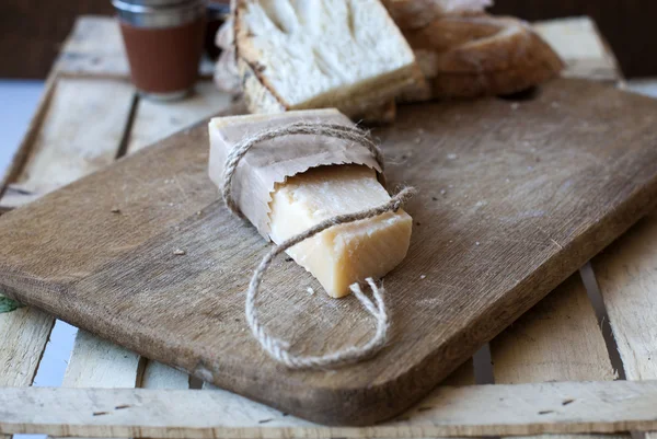 Parmesan cheese on the board — Stock Photo, Image