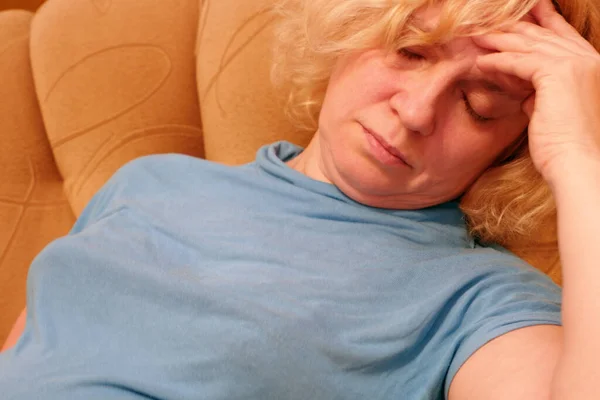 The woman wants to sleep so much that she fell asleep in the chair.