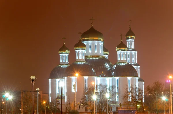 Church in the night city. Glitter gilded domes. — Stock Photo, Image