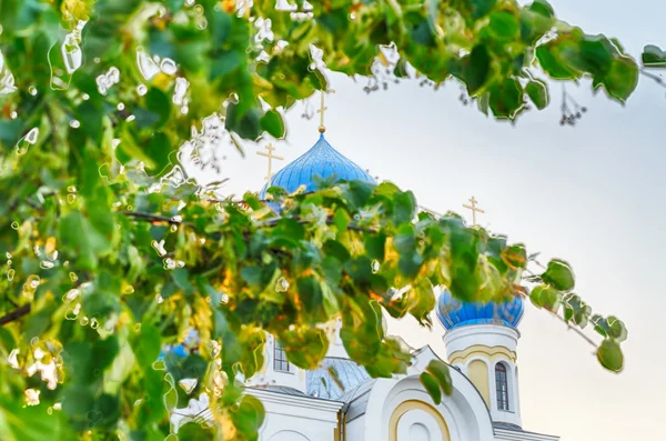 Christian church with blue domes and golden crosses against the — Stock Photo, Image