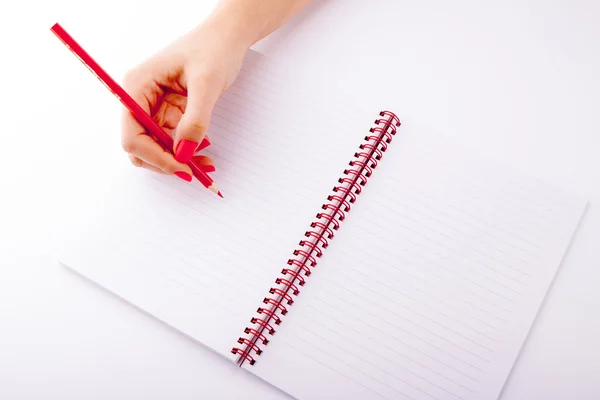 Woman writing on white sheet — Stock Photo, Image