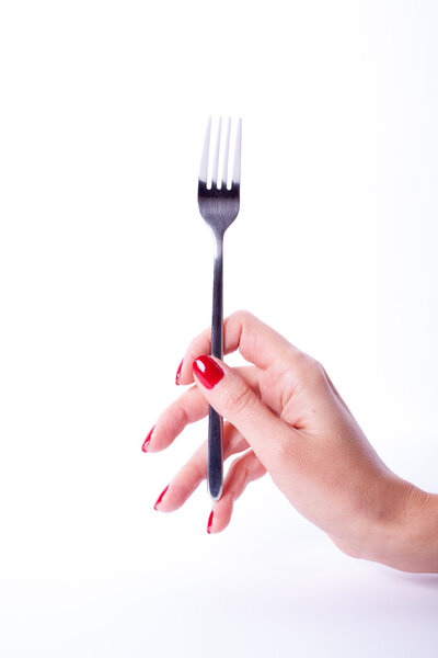 Woman hand holding fork