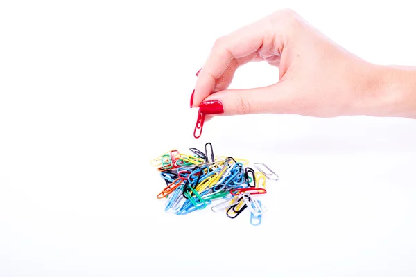 Woman hand holdind paperclip — Stock Photo, Image