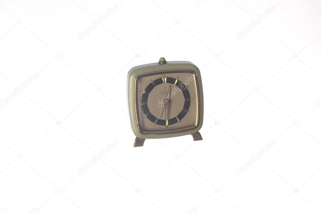 Old alarm clock isolated on white