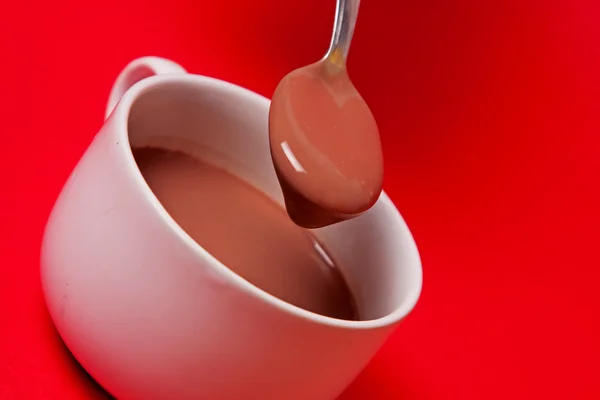 Hot chocolate with spoon — Stock Photo, Image