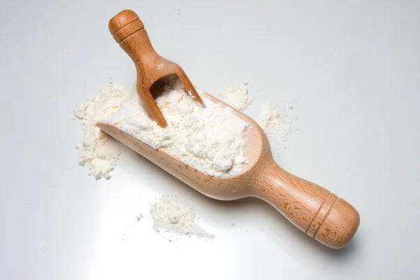 Wooden spoons with flour — Stock Photo, Image