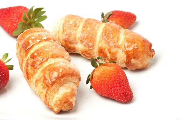 Strawberry and puff pastry rolls filled with cream — Stock Photo, Image