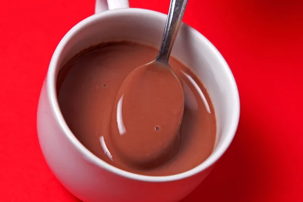 Hot chocolate with spoon — Stock Photo, Image