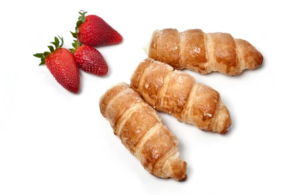 Strawberries and puff pastry rolls — Stock Photo, Image