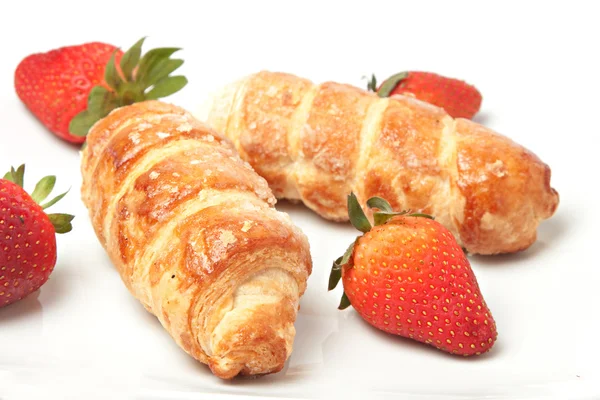 Strawberries and puff pastry rolls — Stock Photo, Image