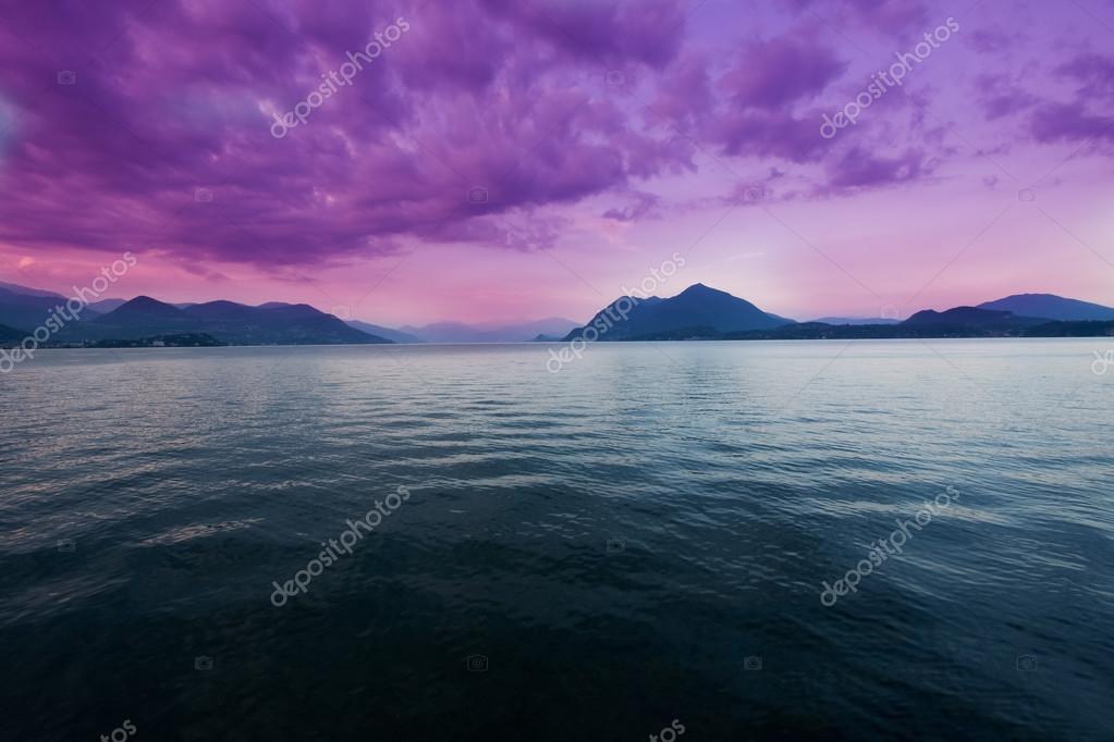 View of Lake Maggiore from the shore at sunset