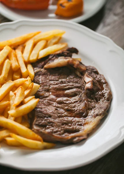 Beef steak with French fries — Stock Photo, Image