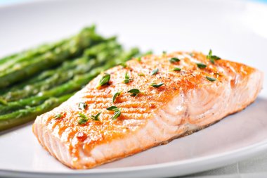 Fillet of salmon with asparagus clipart