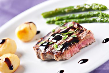 Fillet of beef with asparagus and potateos clipart