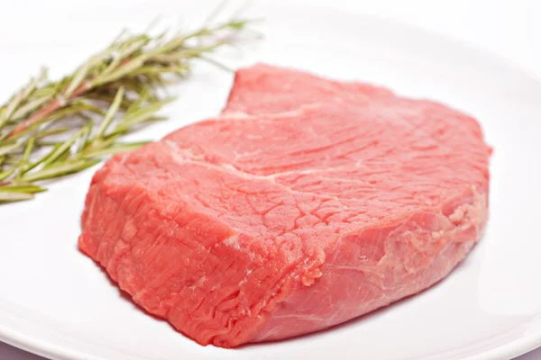 Fresh beef and rosemary — Stock Photo, Image