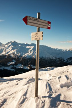 Sign on the snow-capped Italian Alps clipart