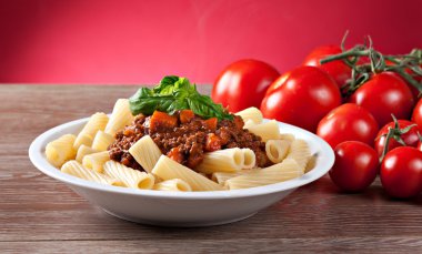 Macaroni Bolognese and tomatoes clipart