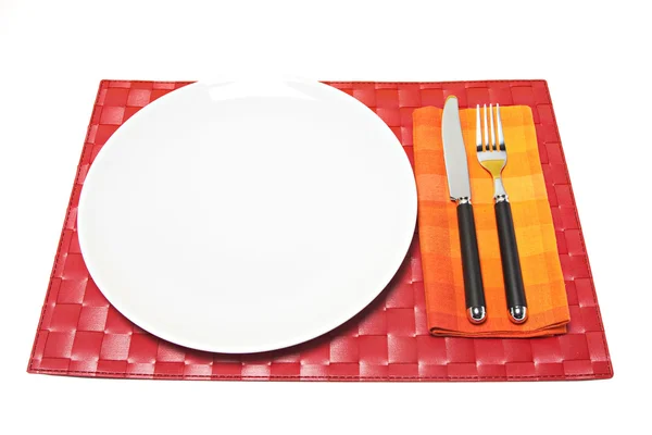 Red placemat with fork and knife — Stock Photo, Image