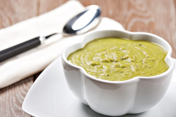 Pea soup on plate — Stock Photo, Image