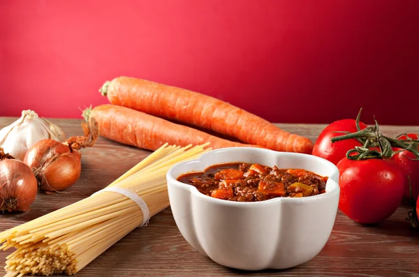 Bolognese sauce and different ingredients — Stock Photo, Image