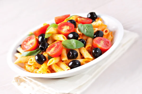 Pasta with tomato sauce and olives — Stock Photo, Image