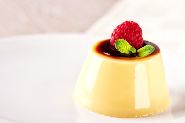 Creme caramel with raspberry clipart