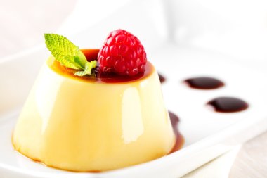 Creme caramel with raspberry clipart