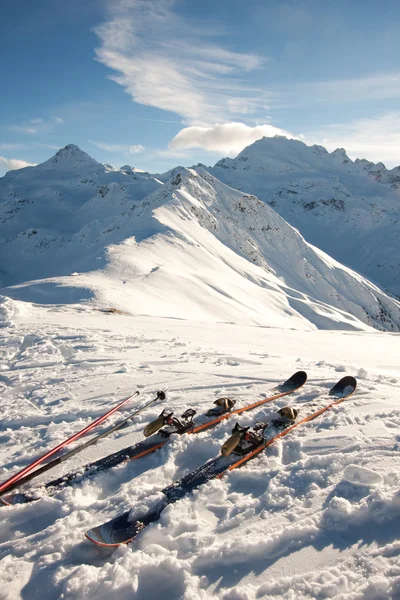 Skis in snow in mountains