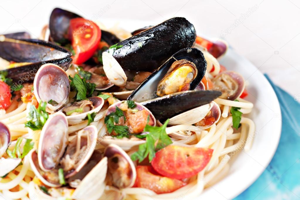 Seafood spaghetti on white plate