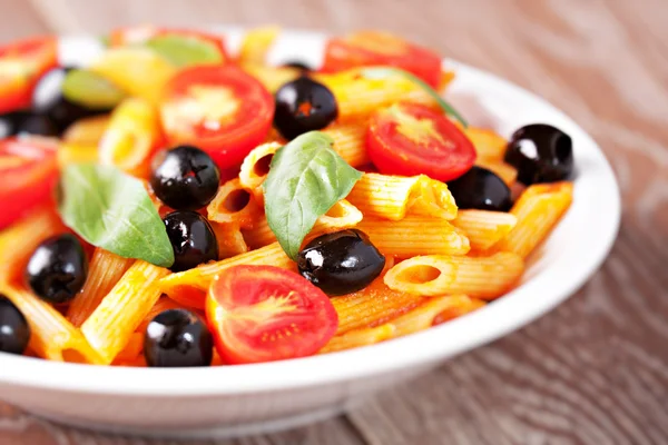 Pasta with tomato sauce and olives — Stock Photo, Image