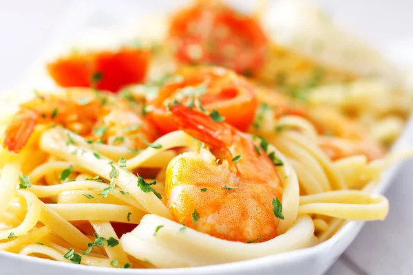 Fettuccine with shrimps and squids Royalty Free Stock Photos