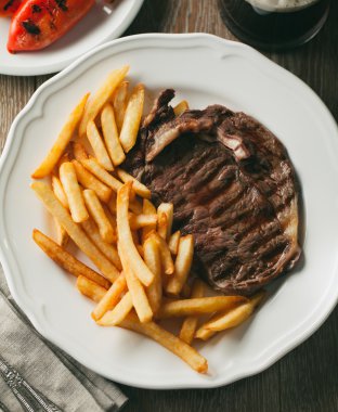 Beef steak with French fries clipart