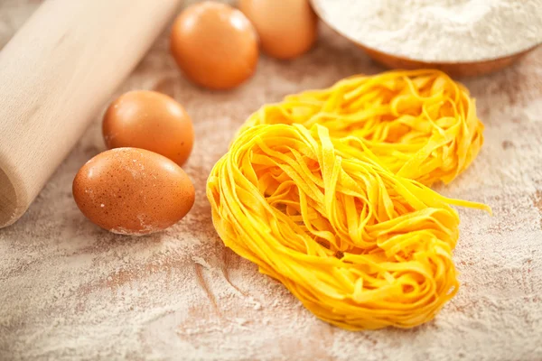 Eggs and flour on table — Stock Photo, Image