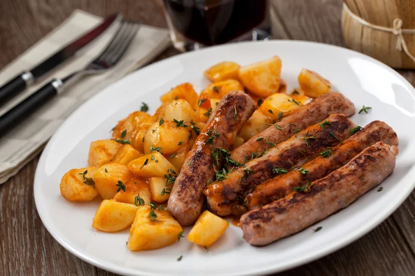 Homemade Sausages and potatoes — Stock Photo, Image