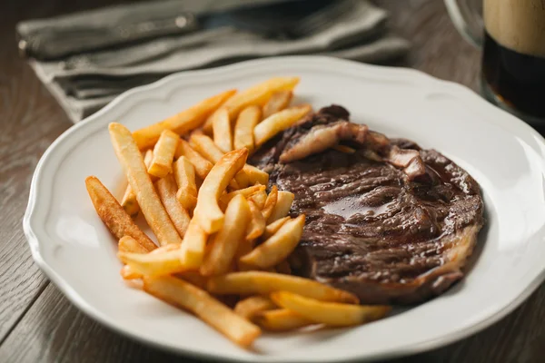 Beef steak with French fries — Stock Photo, Image