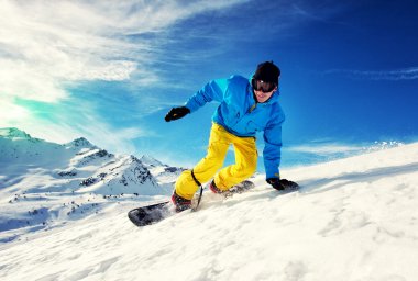 Young man snowboarding clipart