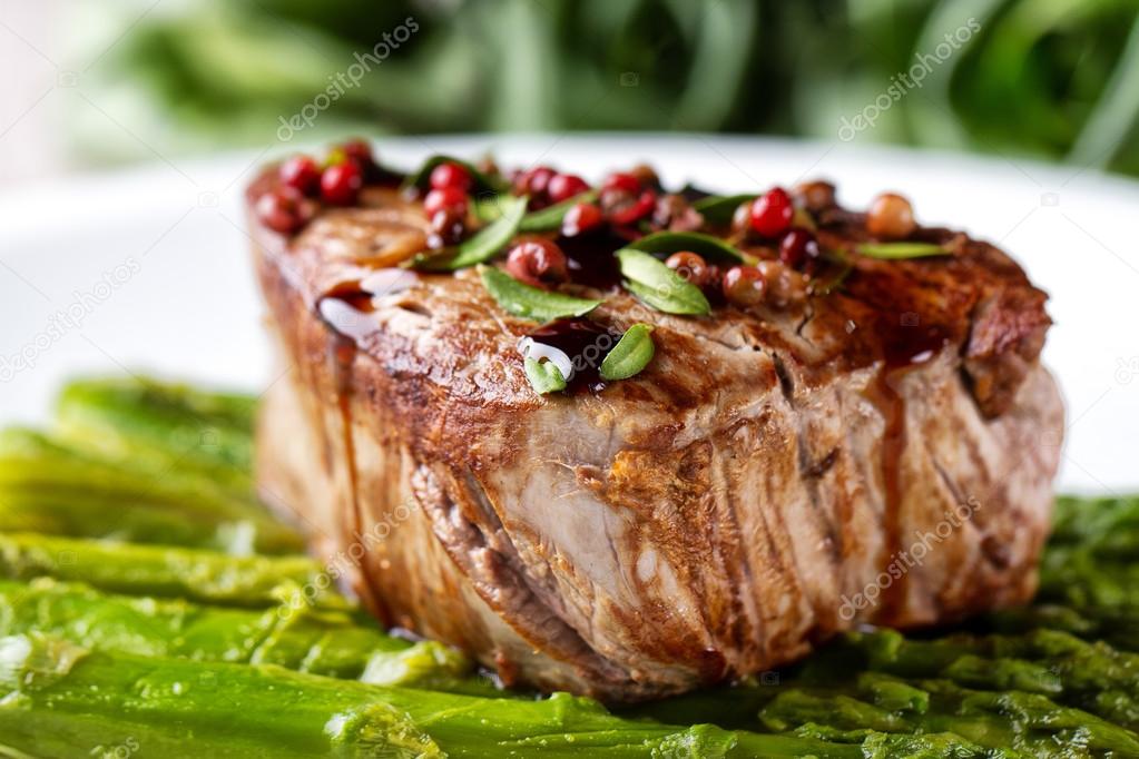 Beef fillet with pink pepper and asparagus.