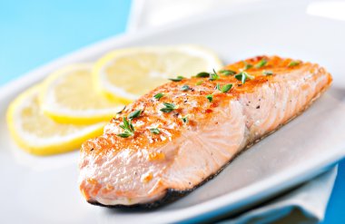 Fillet of salmon on a plate clipart