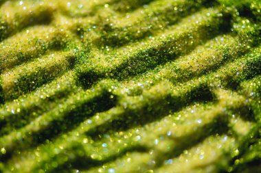 Soyut parıltı ışıkları yeşil ve altın renkli bokeh arkaplan