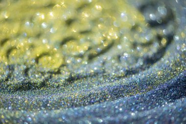 Soyut parlak ışıklar sarı, altın ve mavi renkli bokeh arkaplan