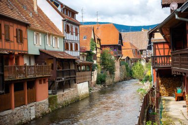 Kaysersberg, Alsace, France -April 5, 2019: The river Weiss flowing through the old town  clipart