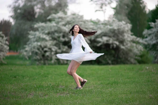 Young Happy Woman Brunette White Dress Runs Dancing Blooming City — Stock Photo, Image