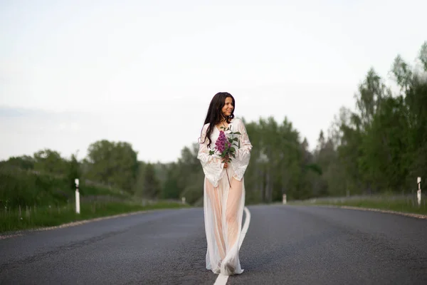 Young Woman Wear White Dress Holding Lilac Flower Empty Country — Stockfoto