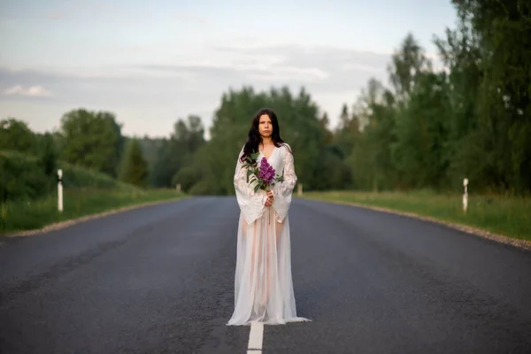 Young Woman Wear White Dress Holding Lilac Flower Empty Country — Stockfoto