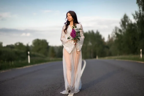 Young Woman Wear White Dress Holding Lilac Flower Empty Country — Stockfoto