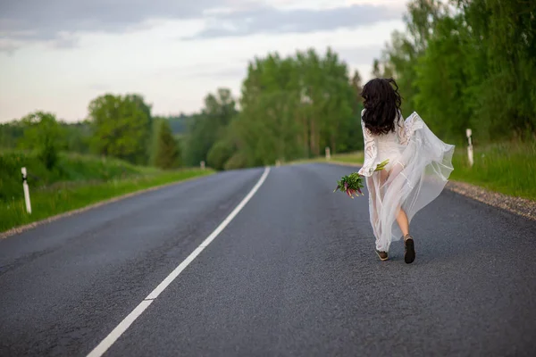Rear View Young Woman White Dress Running Asphalt Country Road — Stock fotografie