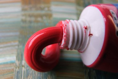 closeup photo of squeezed oil paint tube