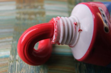 closeup photo of squeezed oil paint tube