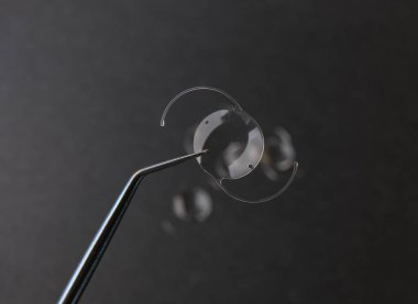 closeup photo of elastic intra ocular lens for cataract surgery